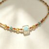 ELA BOUTIQUE |AMBER SQUARE SUNBURST NECKLACR